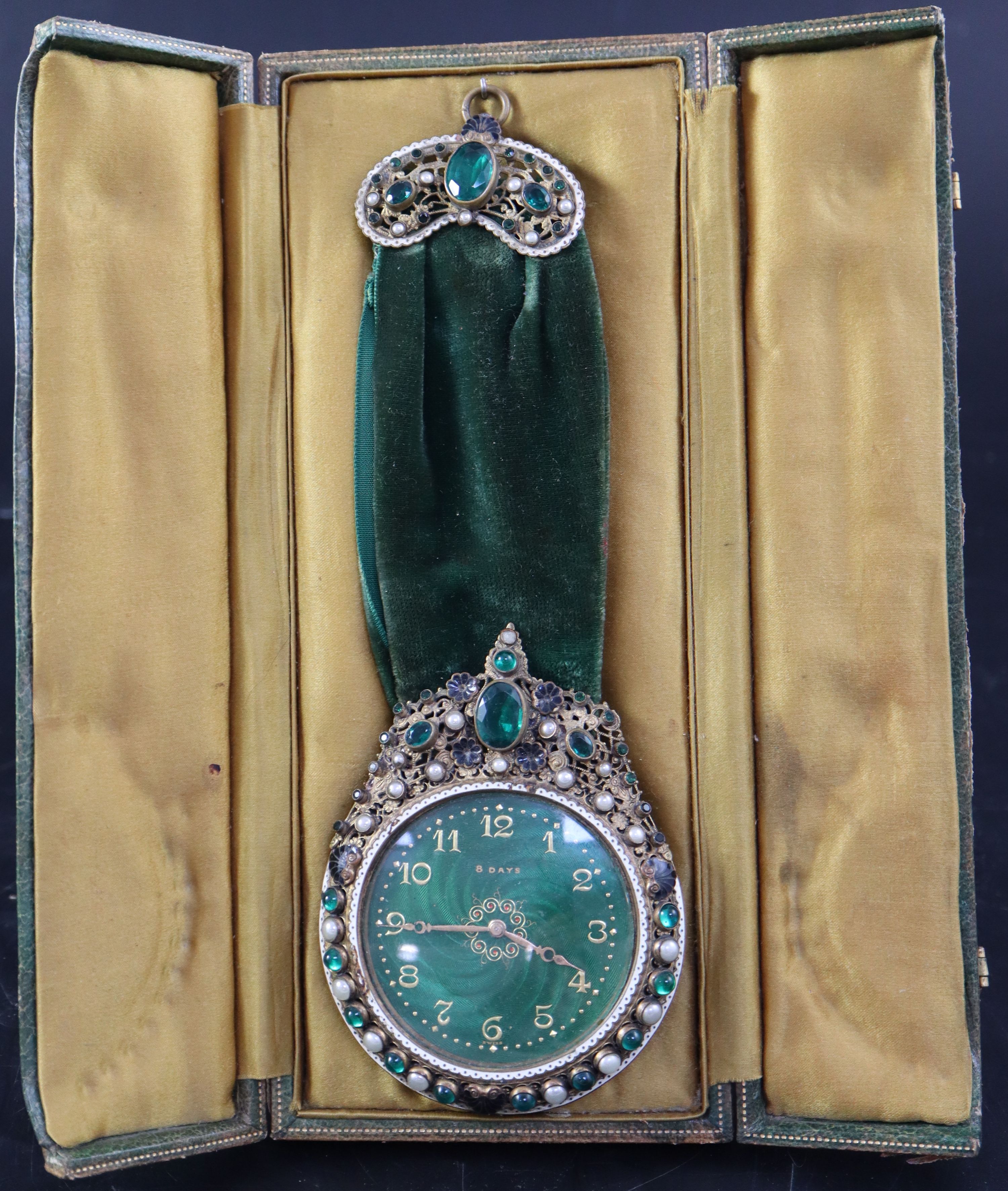 A 1930s Swiss be-jewelled brass eight day pendant timepiece, cased